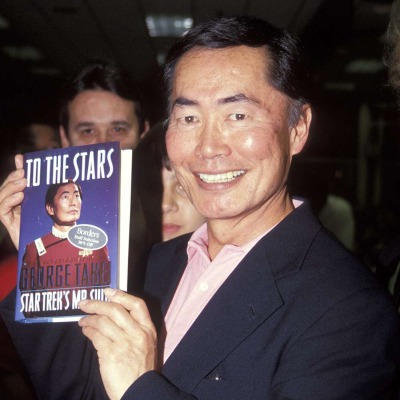 George Takei shows his autobiography, To The Stars.